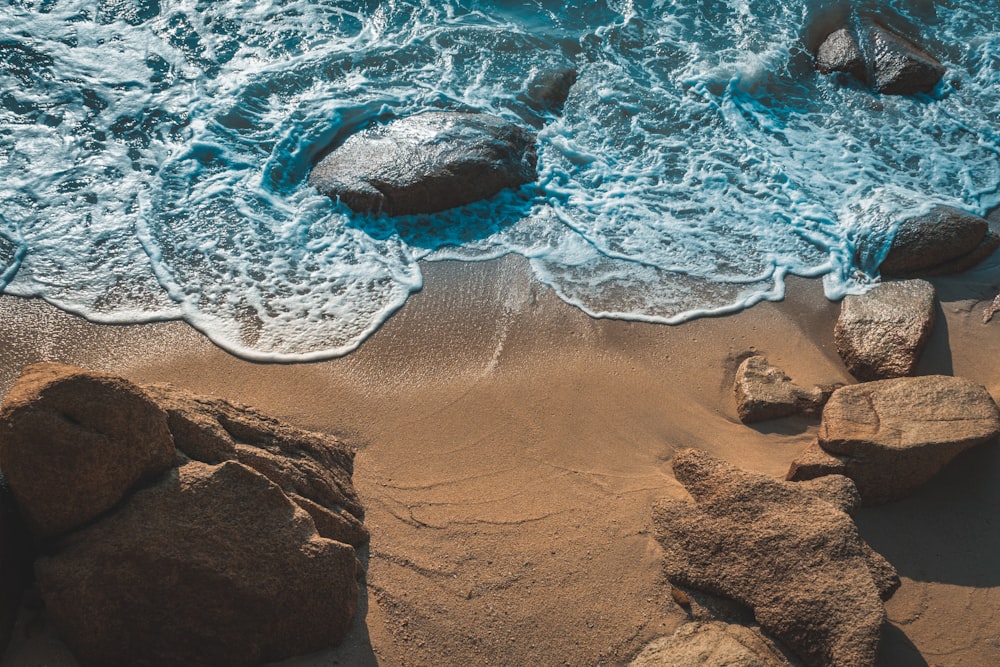 brown sand with water during daytime