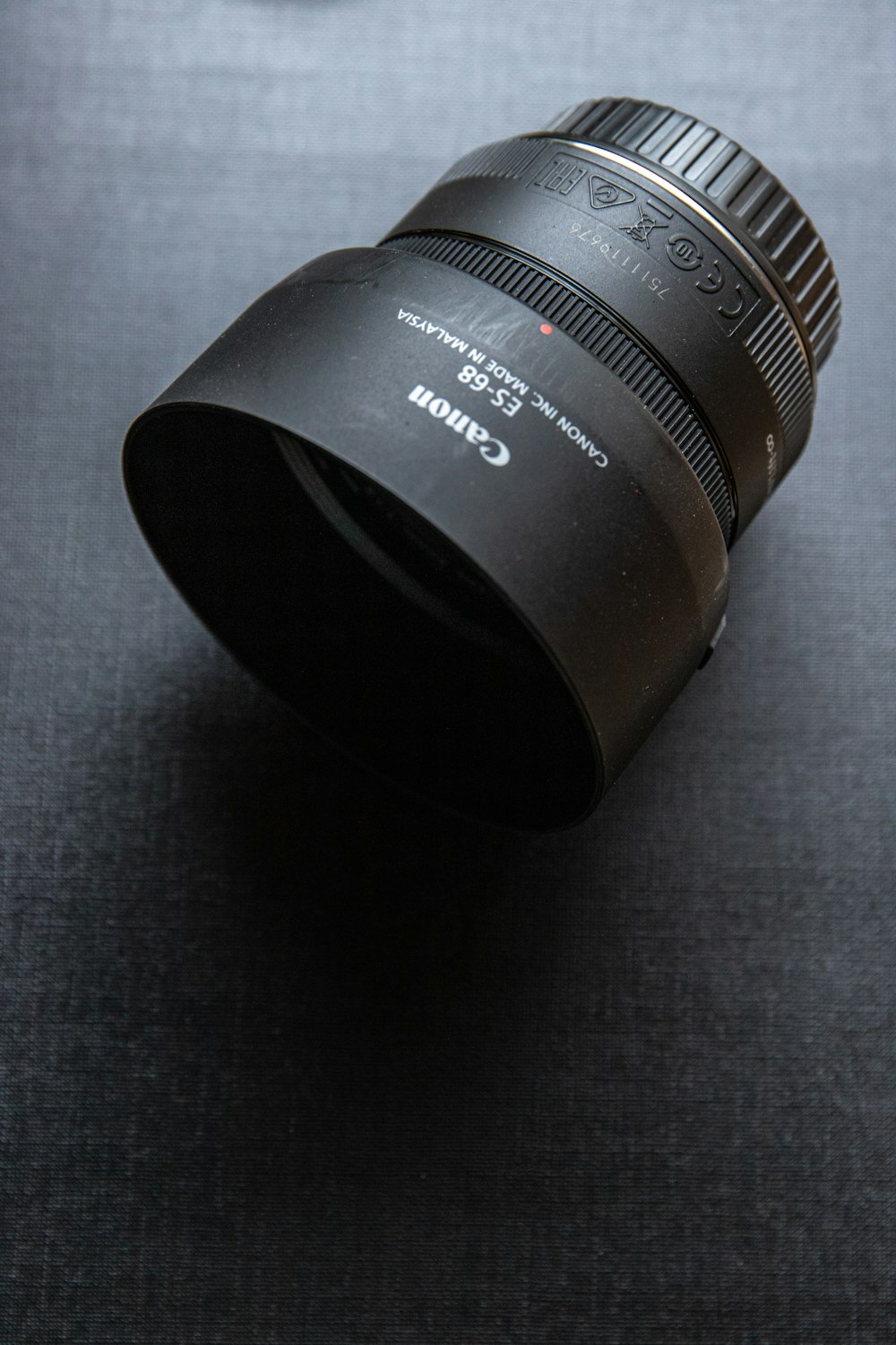 black camera lens on white textile