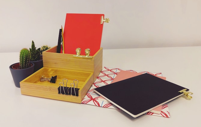 red and gold box on white table