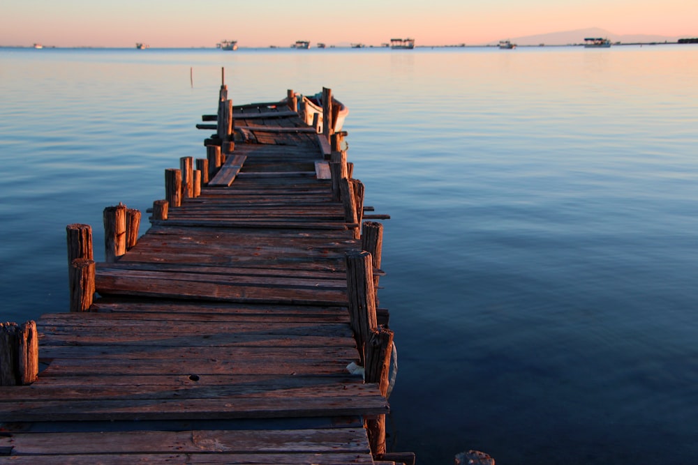 brown wooden dock on sea during daytime