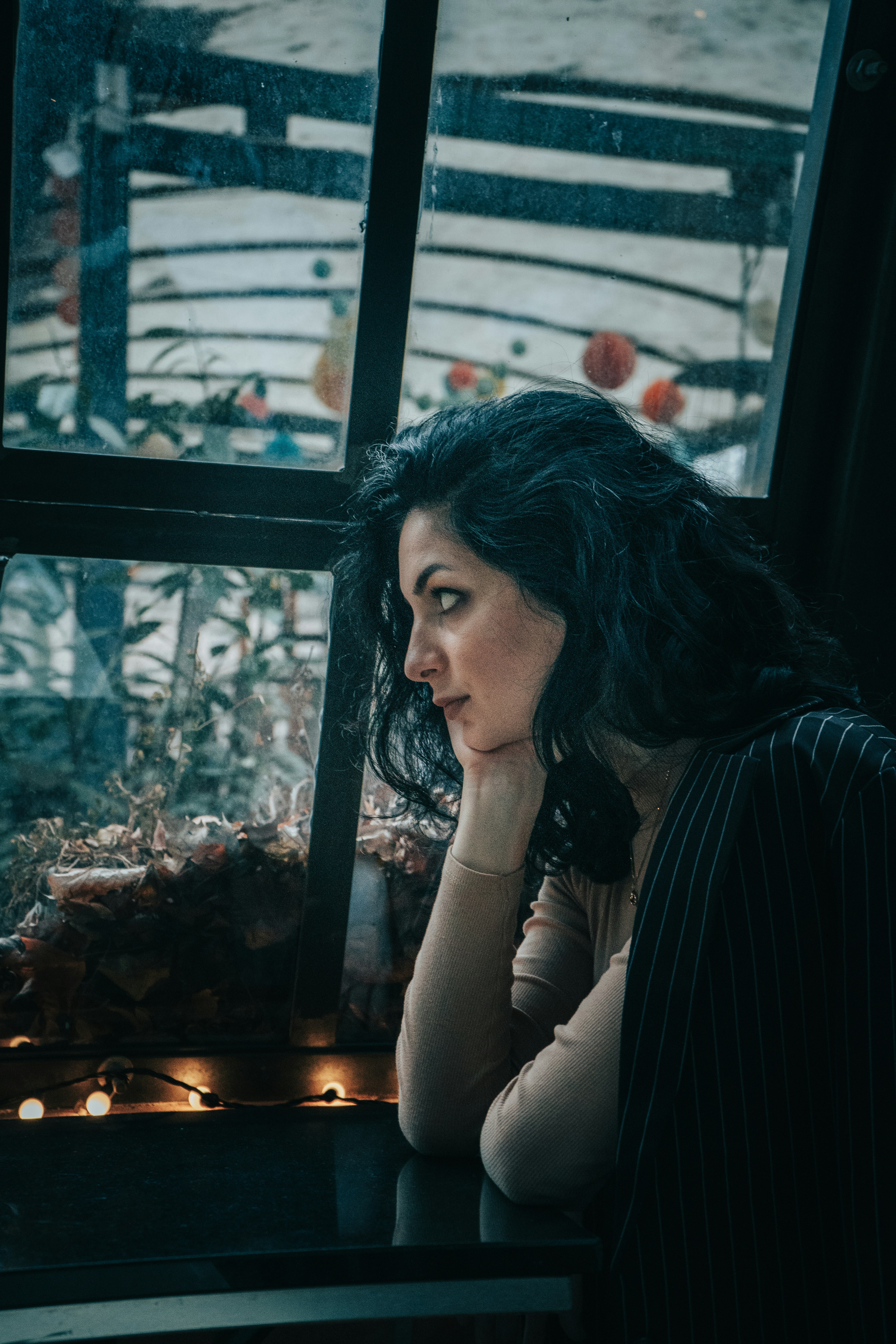 Woman In Black And White Striped Long Sleeve Shirt Sitting Beside