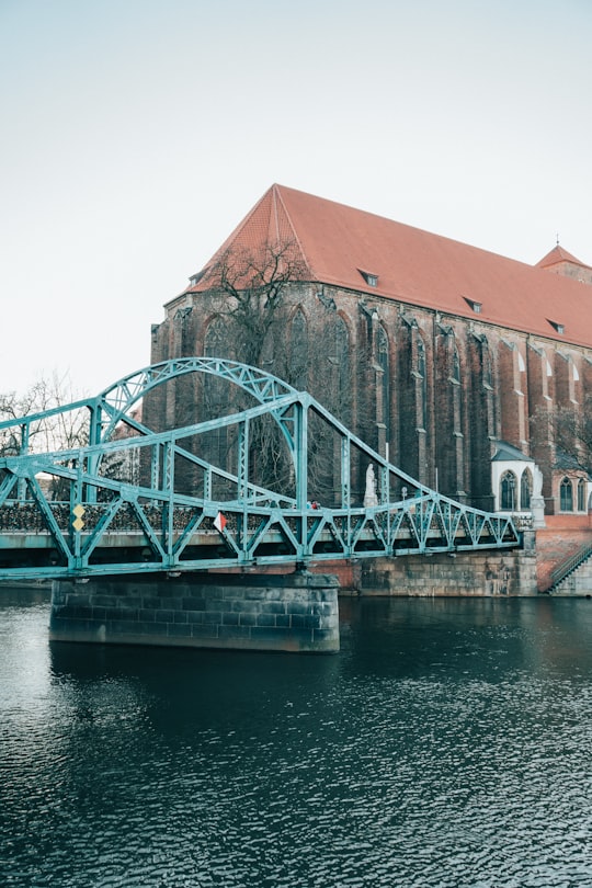 brown brick building near bridge in Wrocław Poland