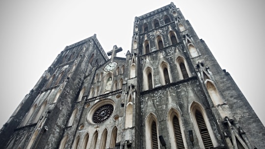 brown concrete building during daytime in St Joseph's Cathedral Vietnam