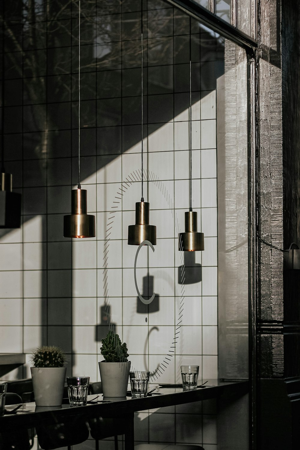 brass bell on white wall