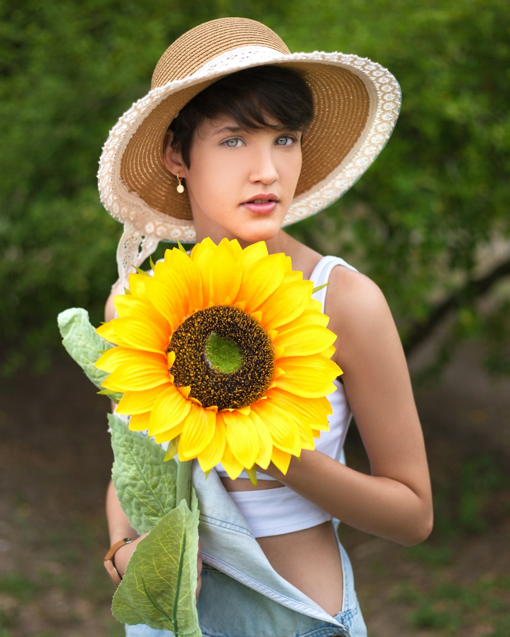 girl in yellow sunflower headband and green sleeveless dress