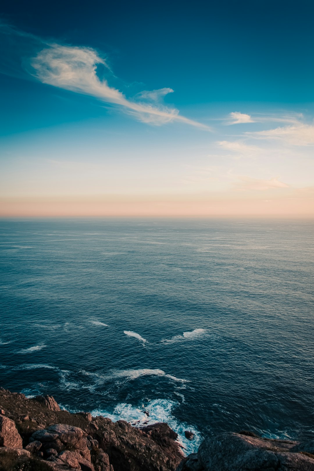 blue ocean under blue sky during daytime