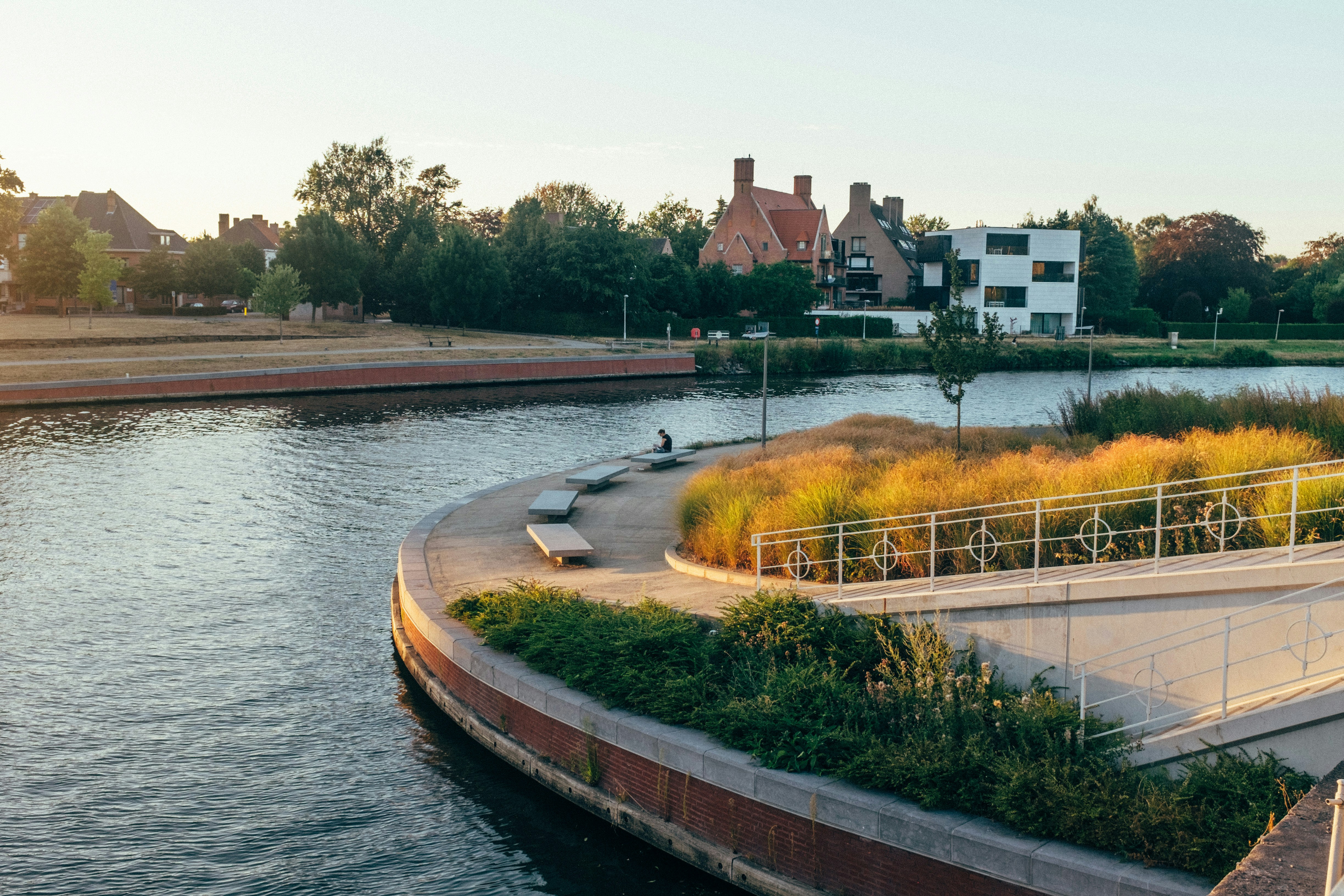 brown concrete bridge over river during daytime belgium teams background