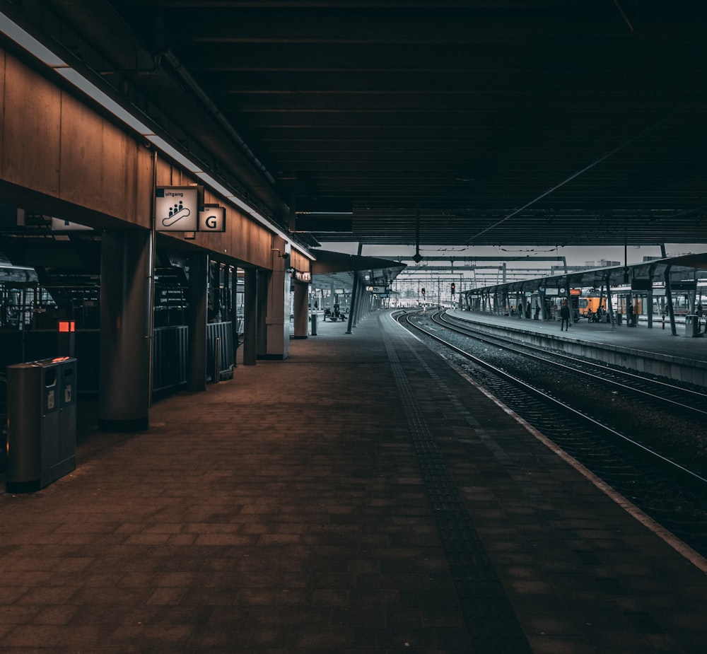 train station with lights turned on during night time