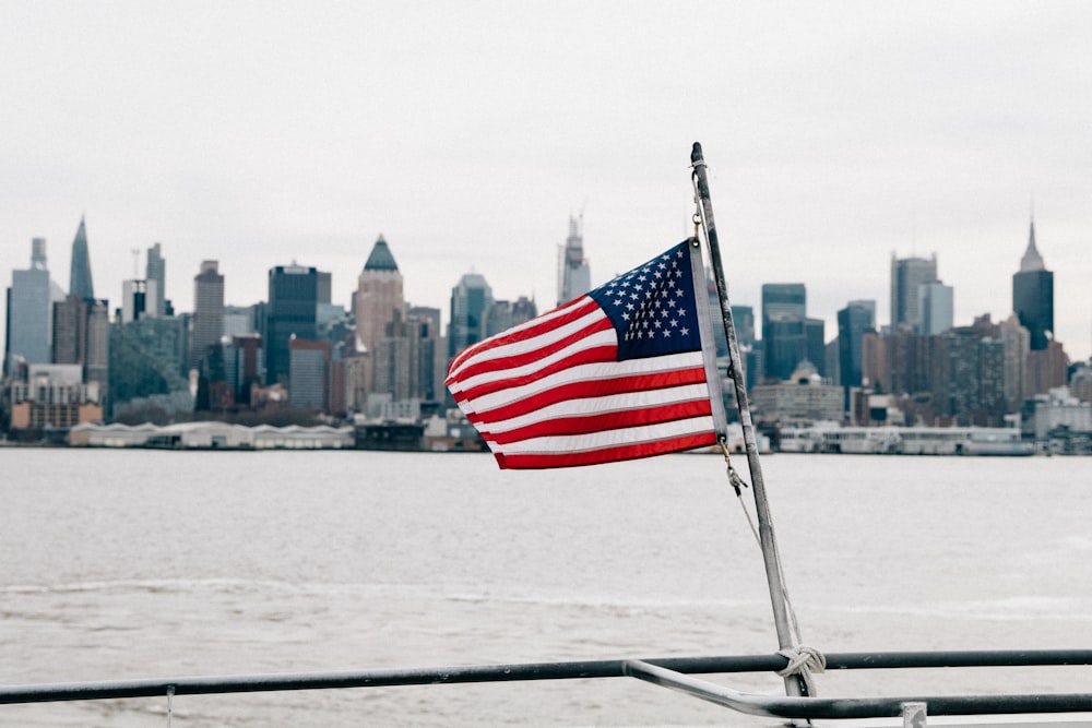 us a flag on white boat during daytime