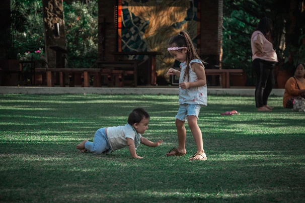 Parents watching their kids play safely from a comfortable seating area beside the grounds.
