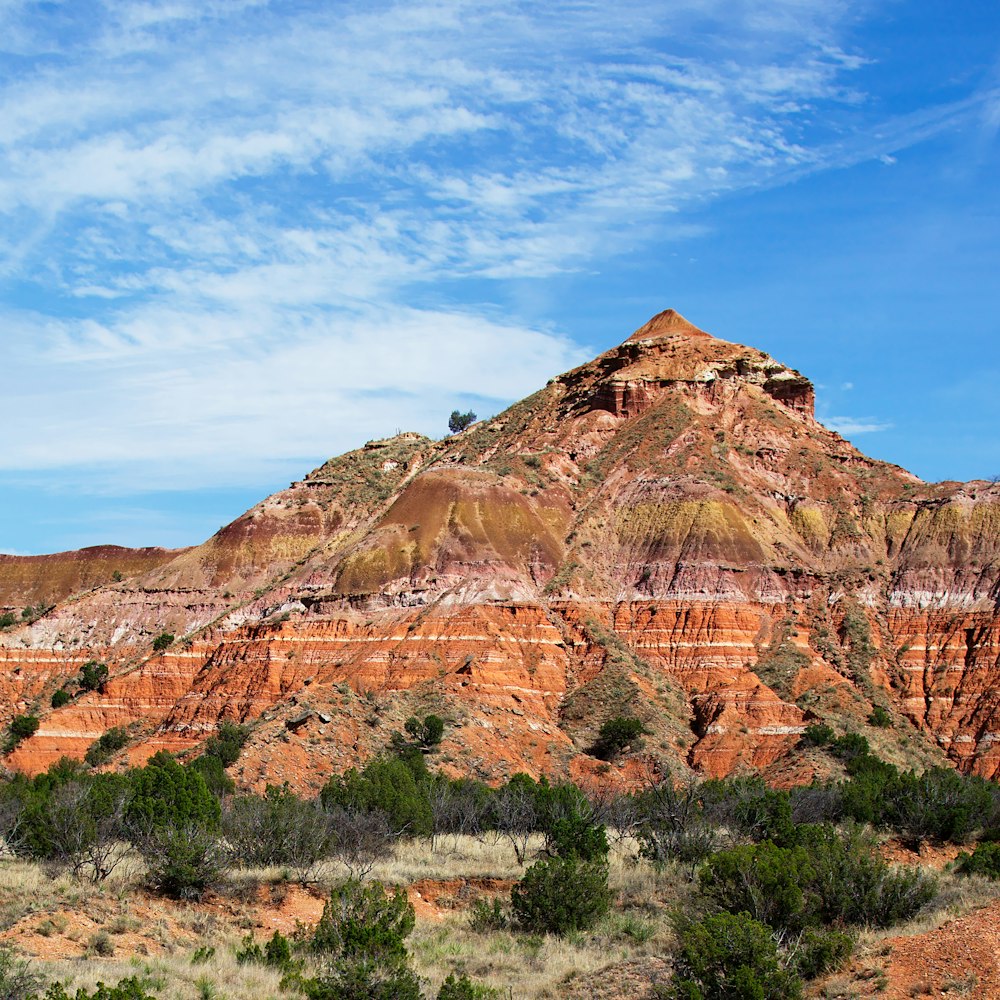 brown rocky mountain under blue sky during daytime