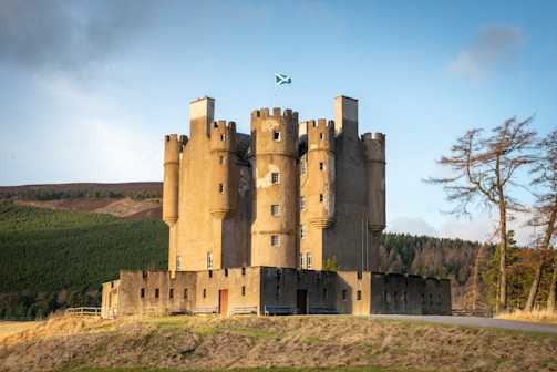 brown concrete castle under blue sky during daytime