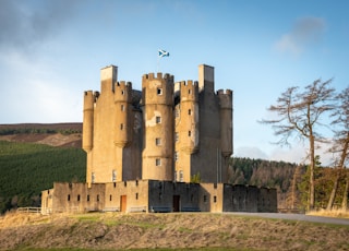 brown concrete castle under blue sky during daytime