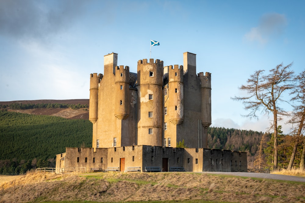 brown concrete castle under blue sky during daytime