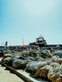 A bustling dock where fresh seafood is unloaded from a fishing boat.