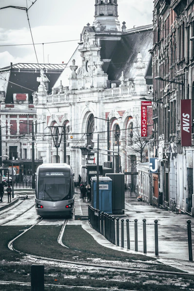 white and black tram on road during daytime