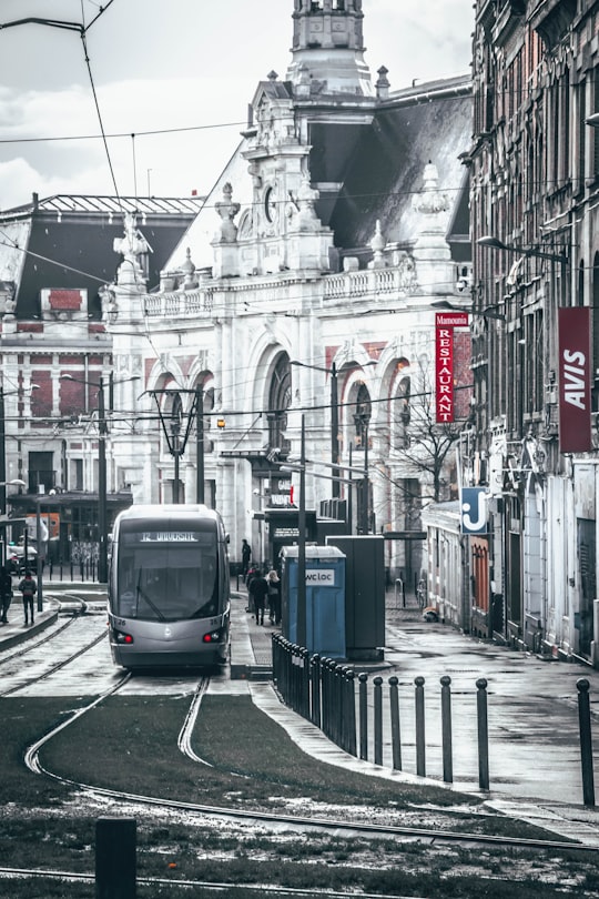 white and black tram on road during daytime in Valenciennes France