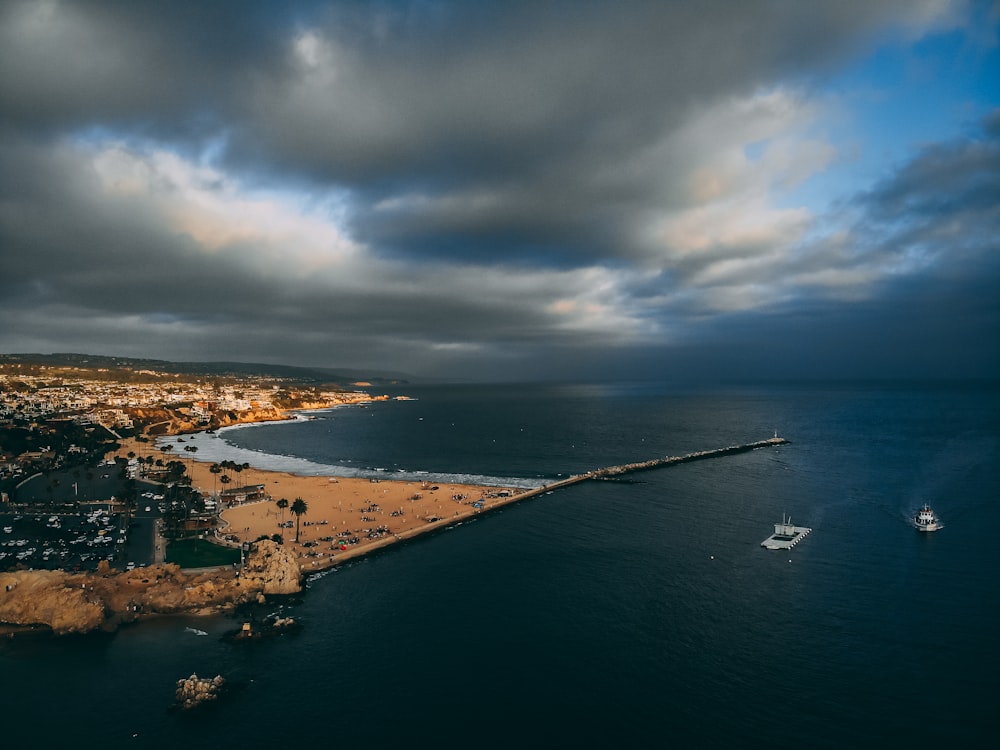 aerial view of city near body of water during daytime