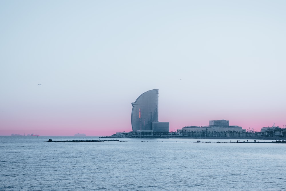 city skyline across body of water during daytime