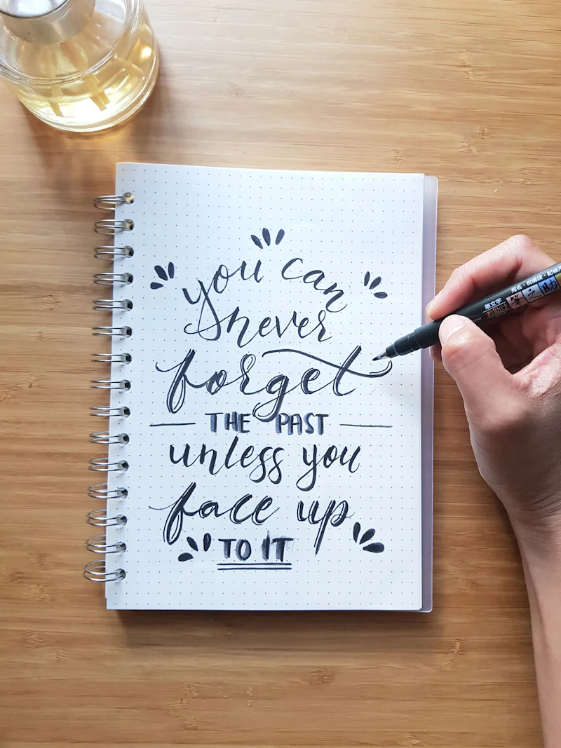 Hand lettering in an open notebook