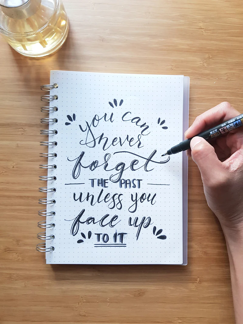 Hand lettering in an open notebook