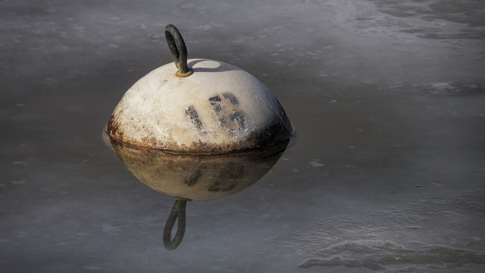 brown and black globe on black metal stand