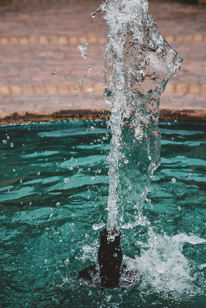 Pool spillover fountain feature with sparkling clear water