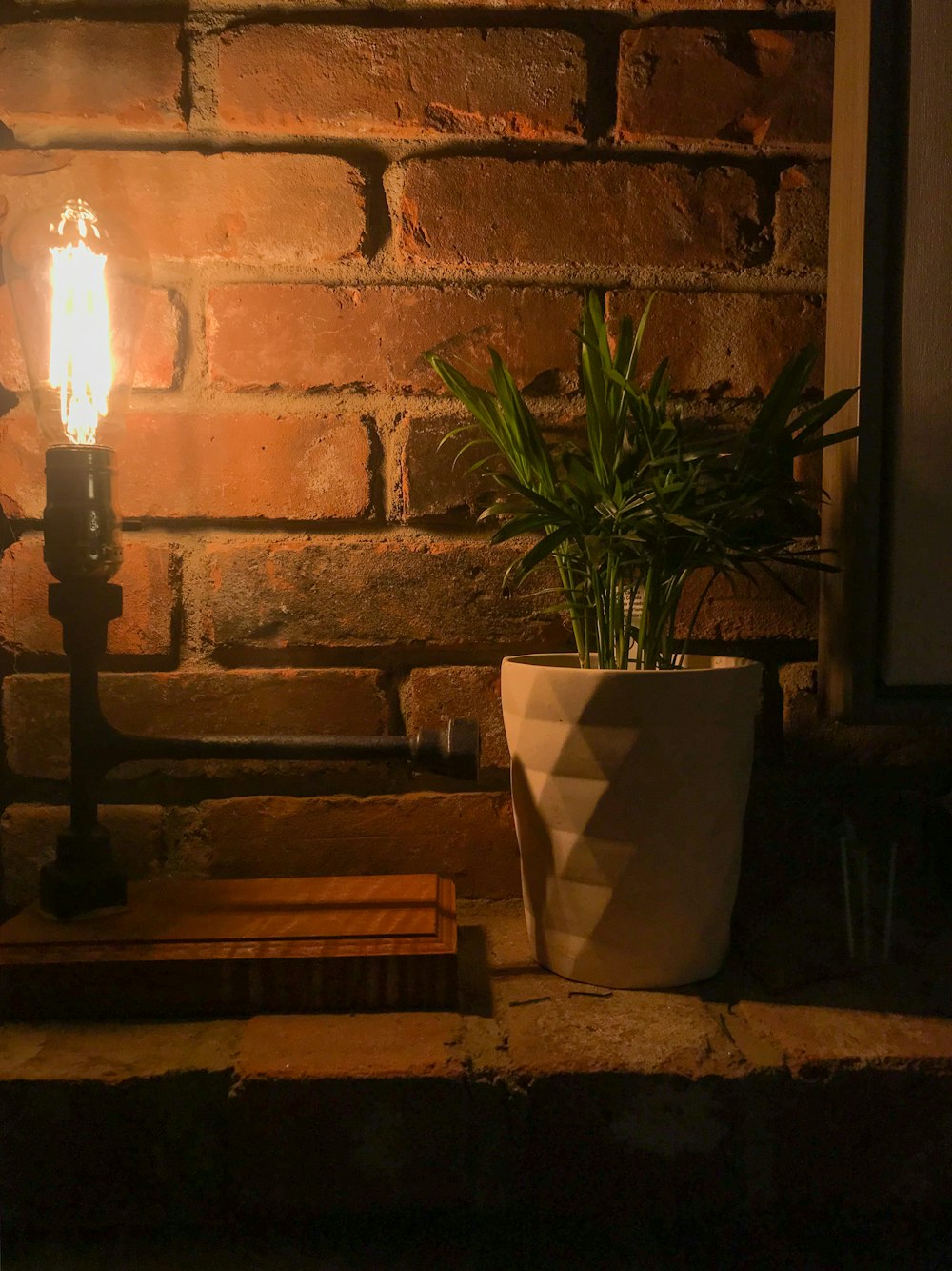 black candle holder on brown wooden table