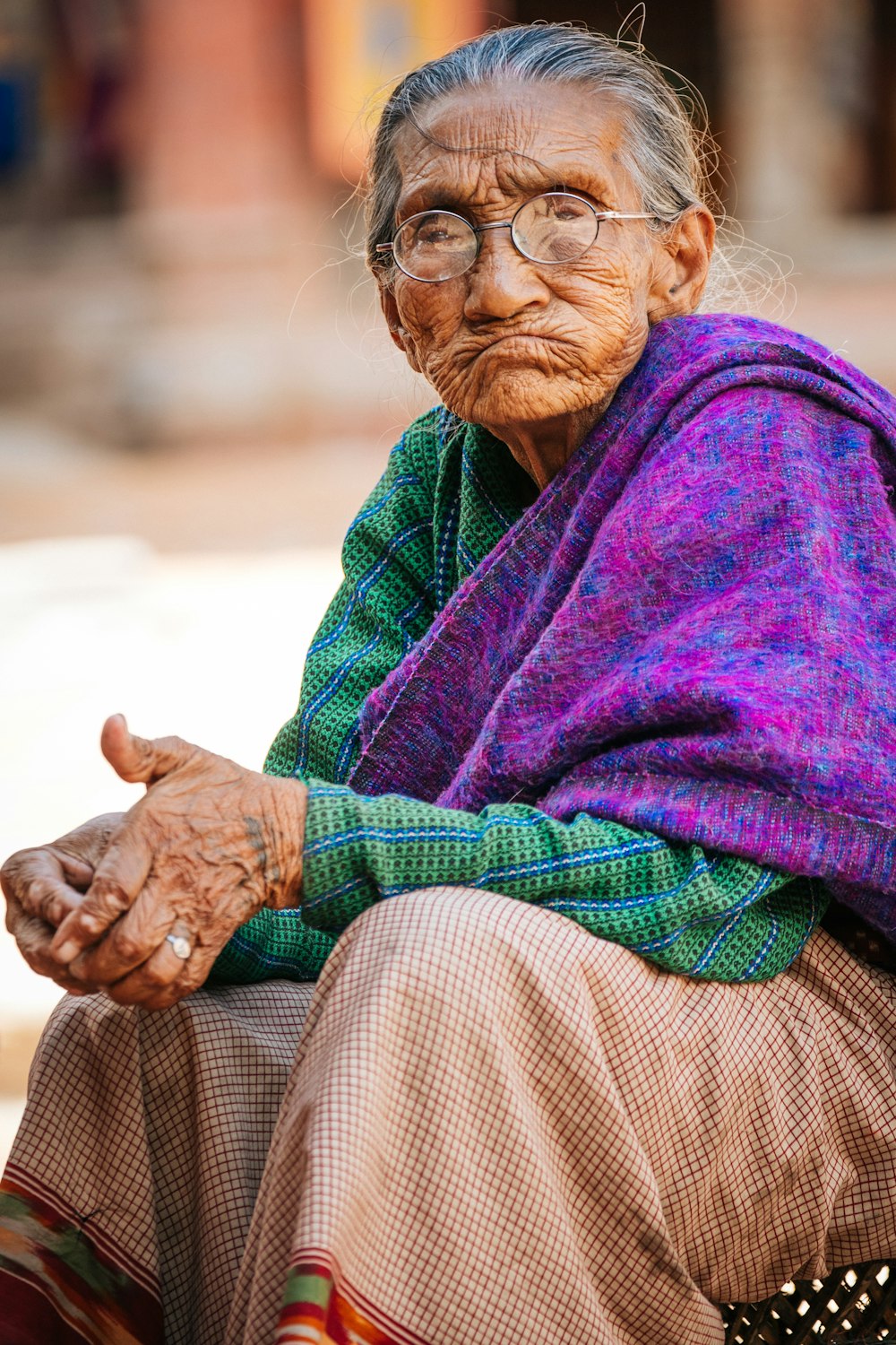 woman in purple scarf and brown long sleeve shirt