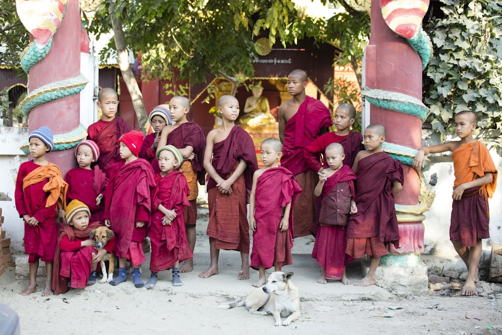 group of people wearing red traditional dress