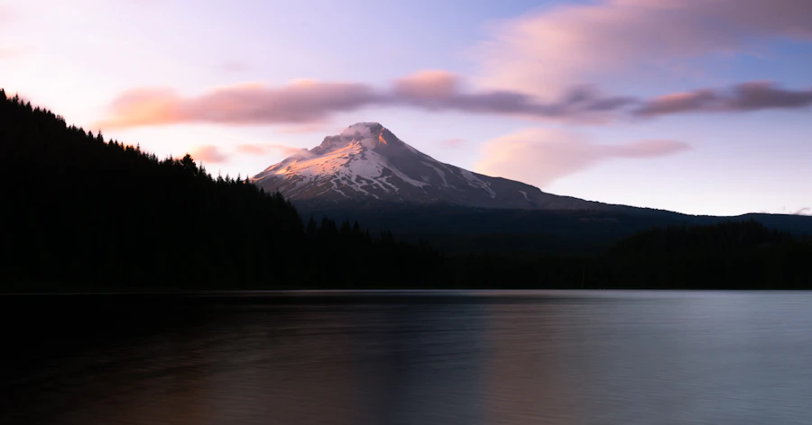 Mount Hood glowing pink above a lake