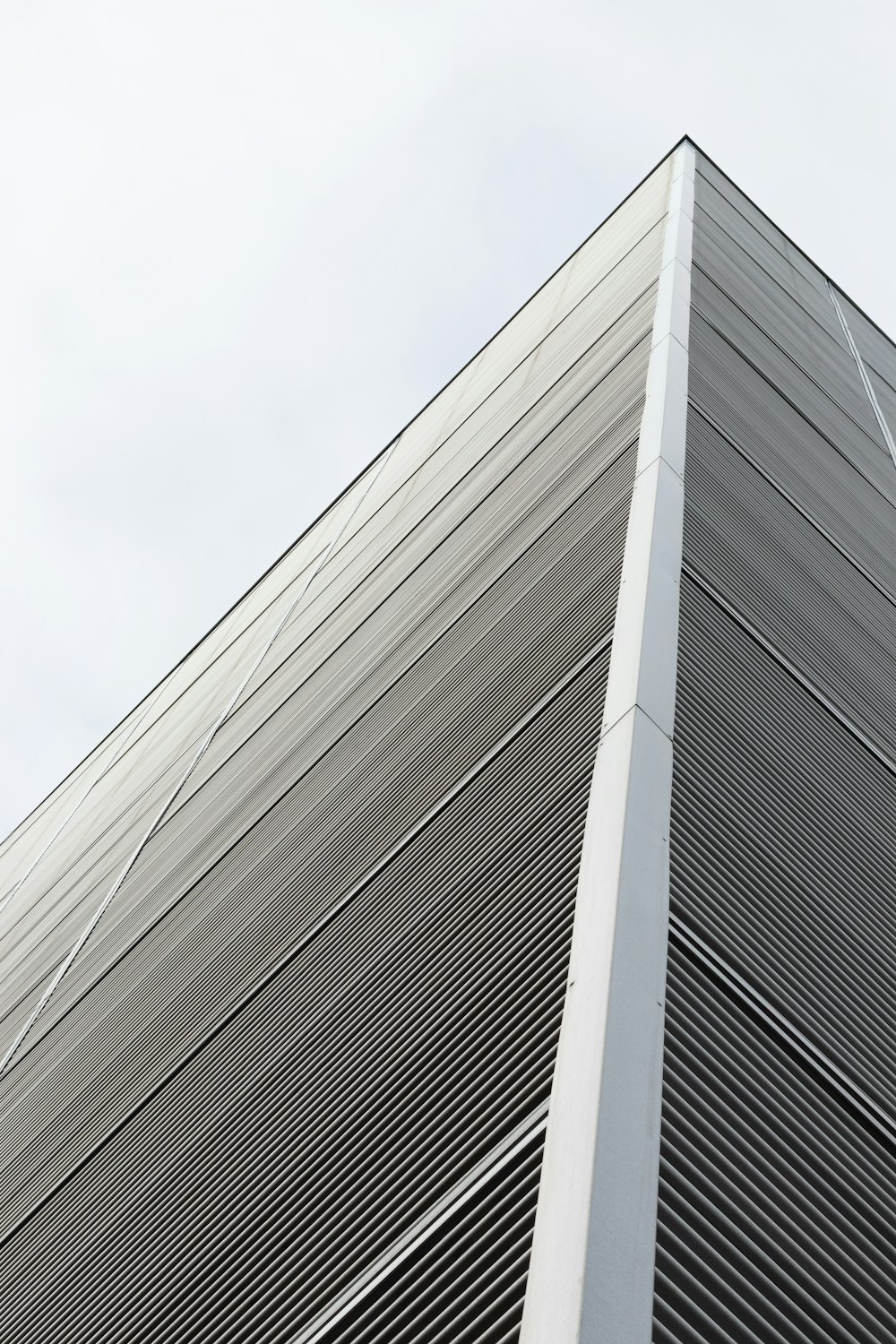 white concrete building under white sky during daytime