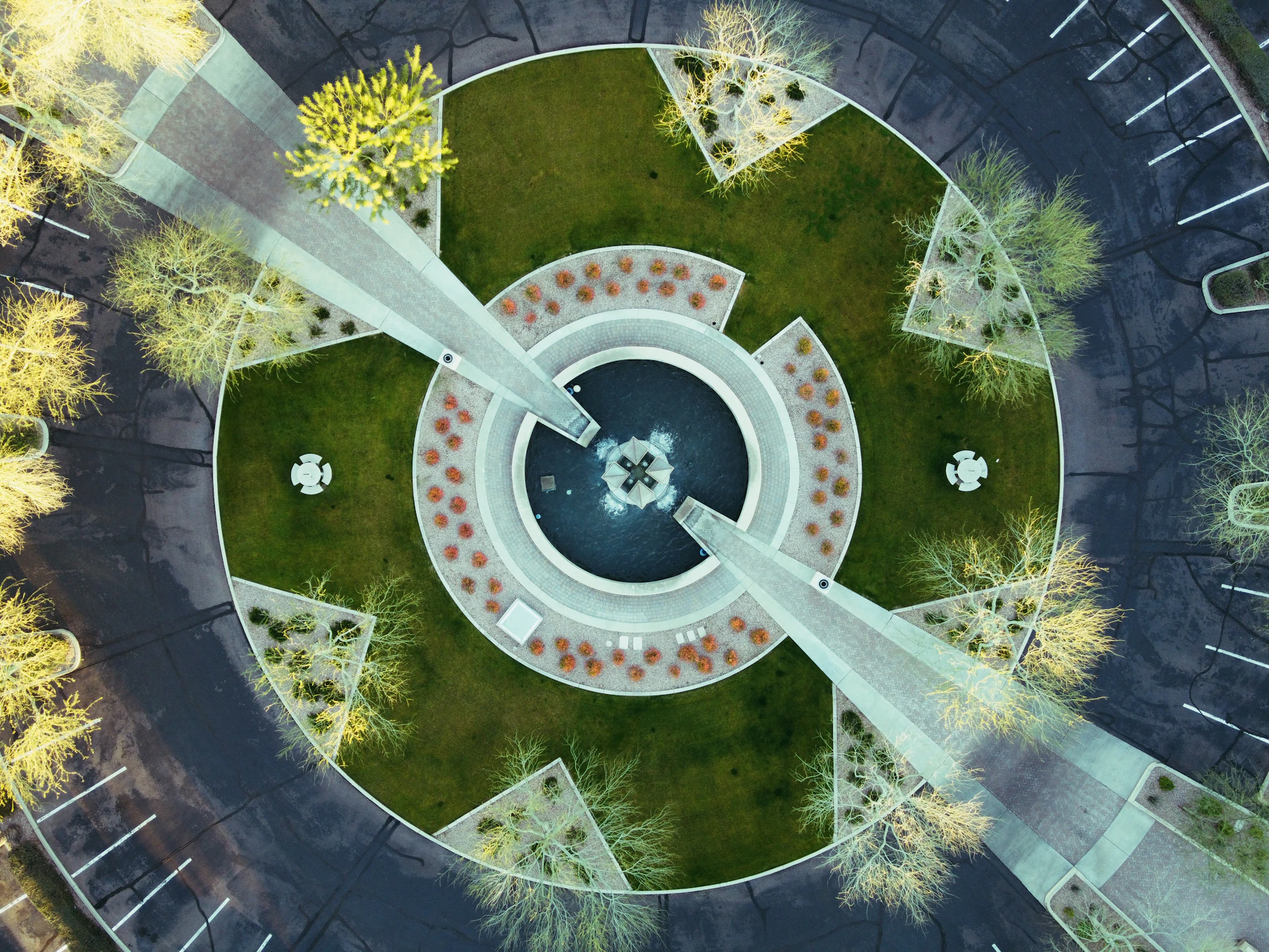 An aerial view of a contemporary urban plaza with clean lines and minimalist landscaping, captured in a crisp architectural visualization style.