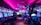 A vibrant arcade with rows of gaming machines adorned with colorful screens. Several people are immersed in playing games, seated on stools in a dimly lit room accented by an intense pink ceiling light. The atmosphere is lively and engaging.