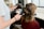woman in red long sleeve shirt holding hair blower