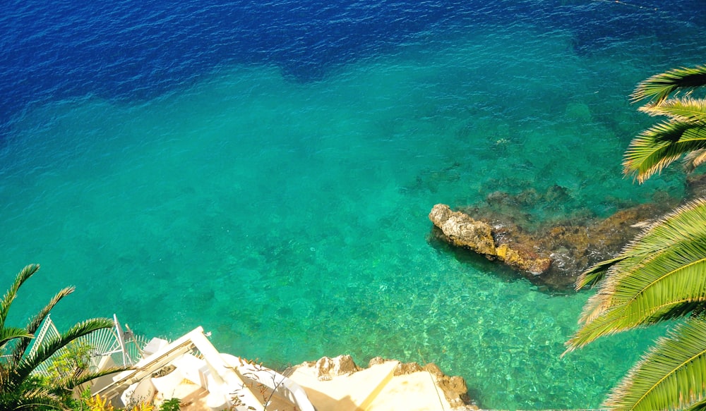 aerial view of white and brown houses beside blue sea during daytime