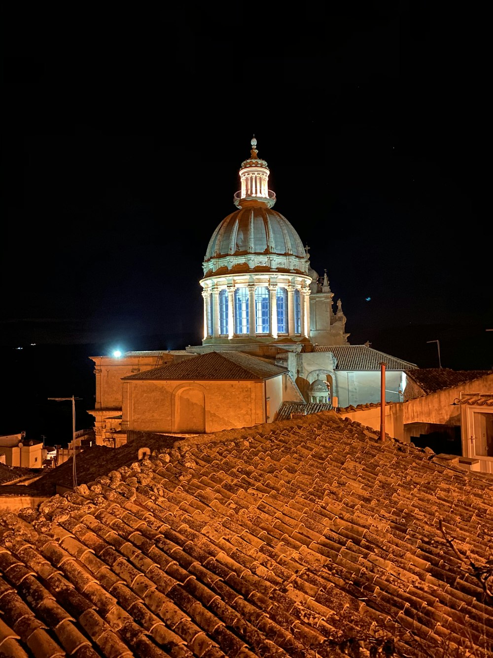 white and brown concrete building during night time