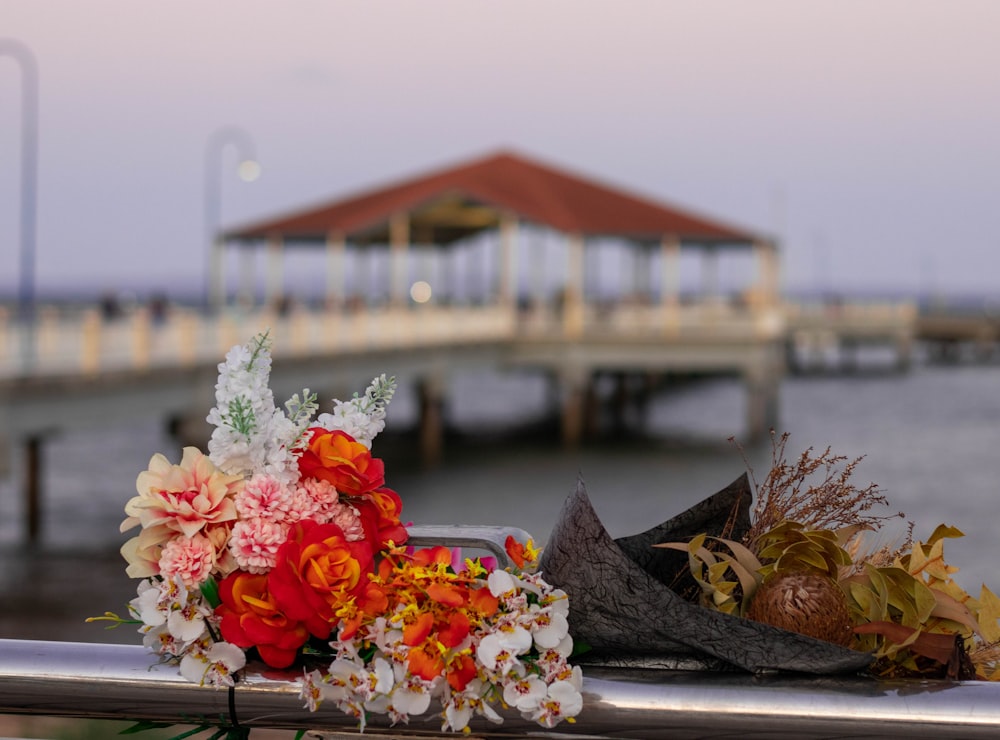 red and white flowers on brown wooden boat