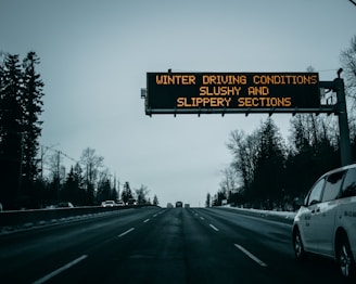 black and yellow road sign