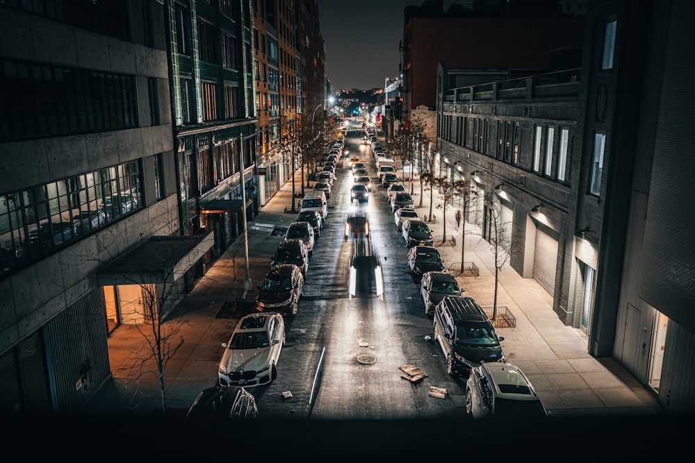 cars parked on side of the road during night time