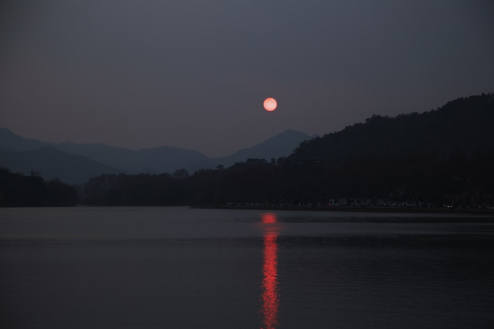 body of water during sunset