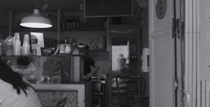 Small business café with a visible water treatment system installed behind the counter.