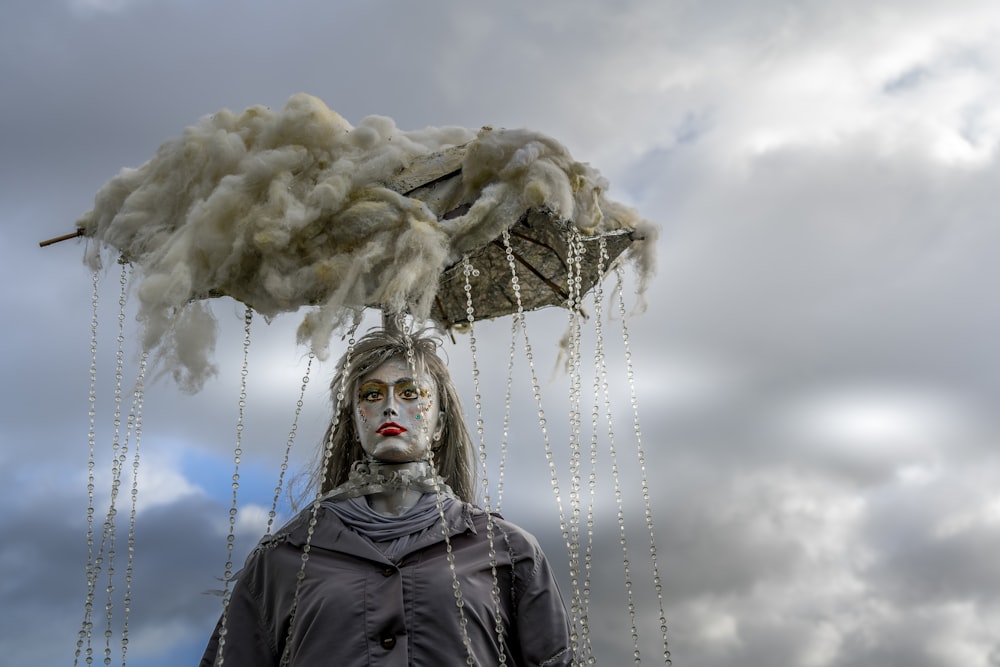 woman in black jacket standing under white clouds during daytime