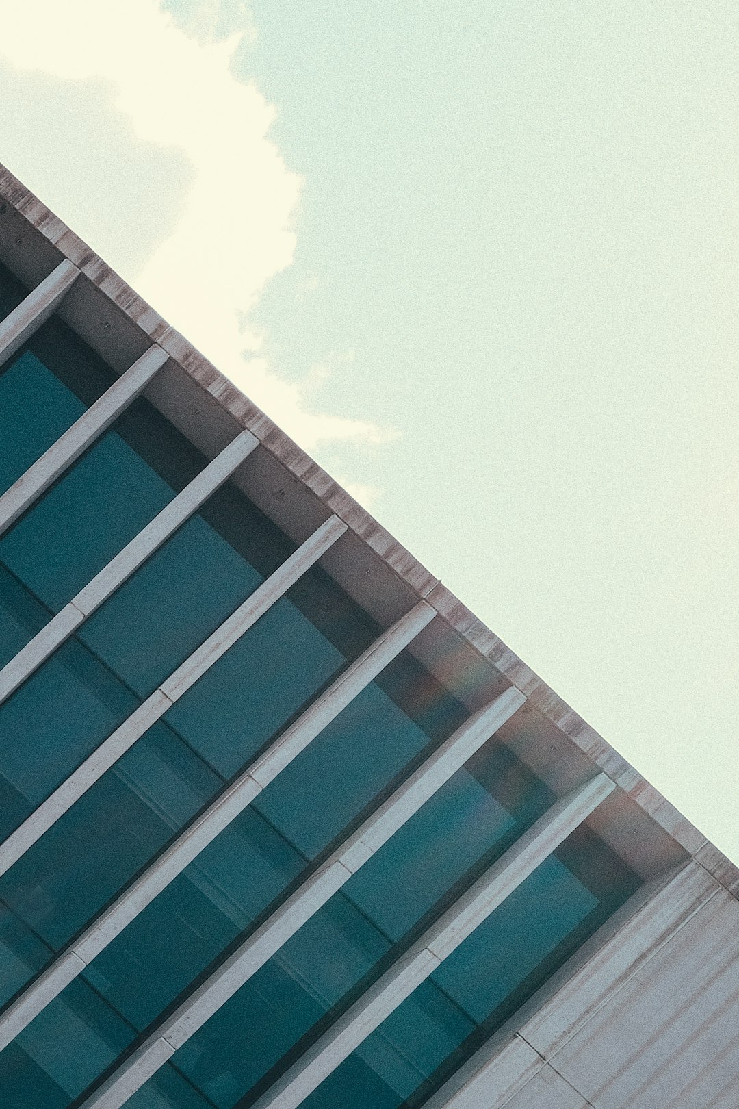 blue and white concrete building under blue sky during daytime