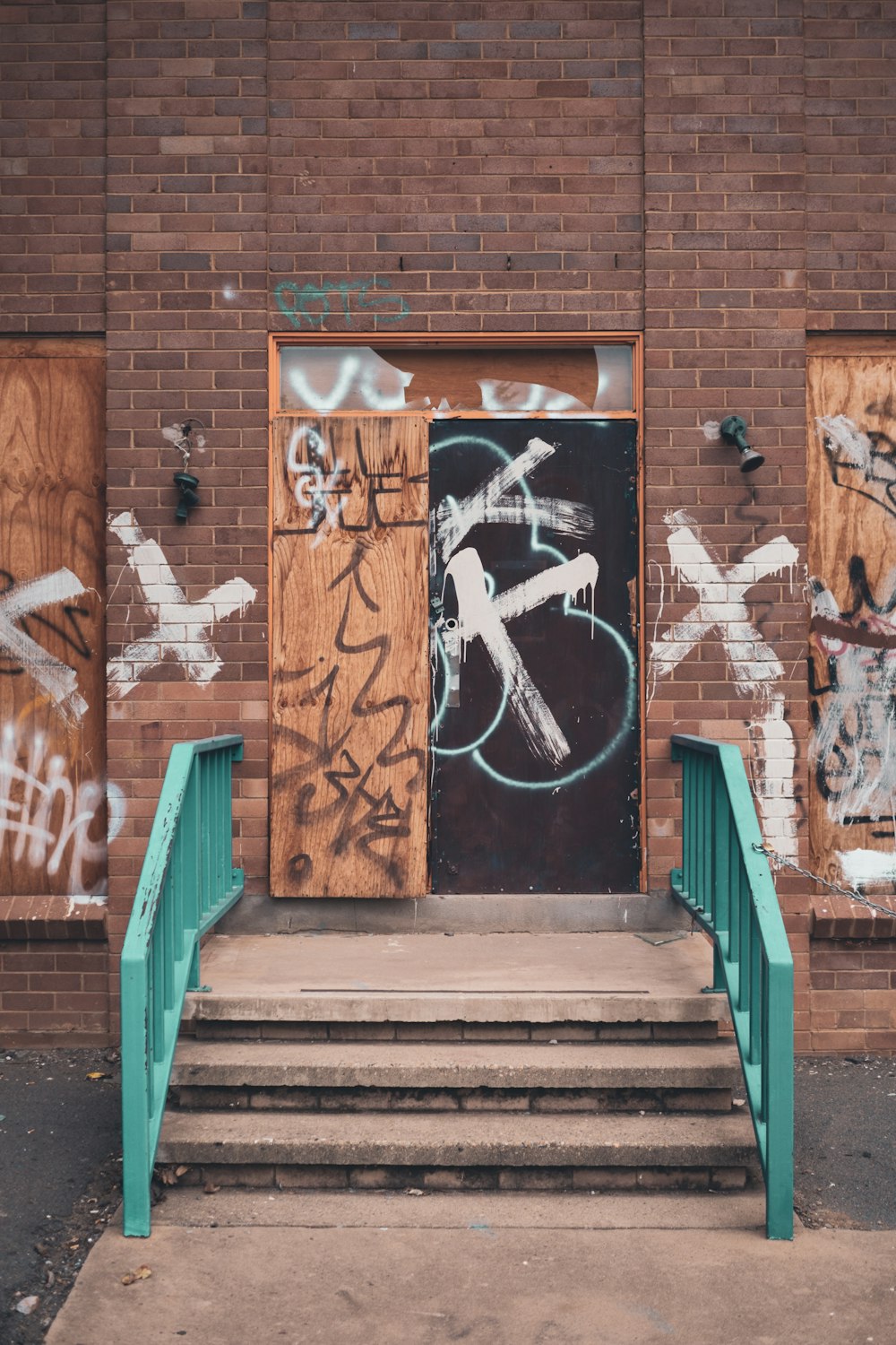 brown brick wall with blue wooden door