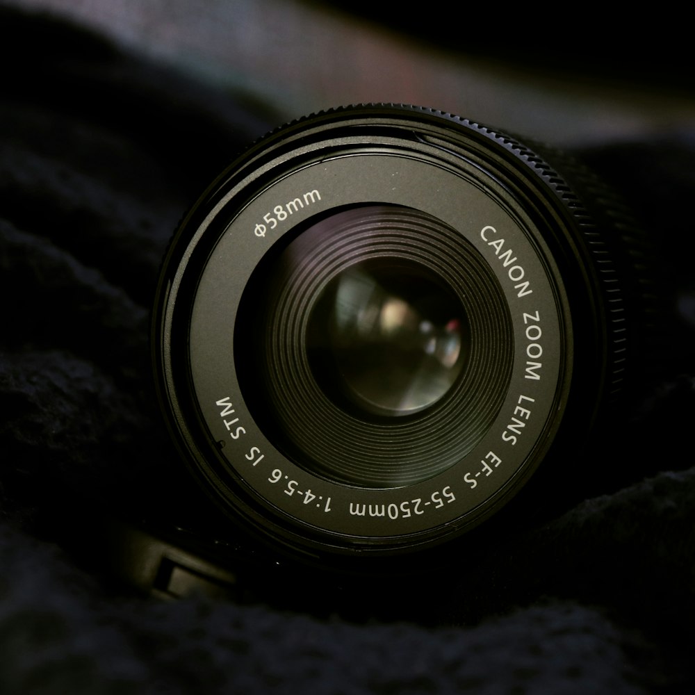 black camera lens on black textile