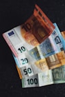 10 euro bill on black textile