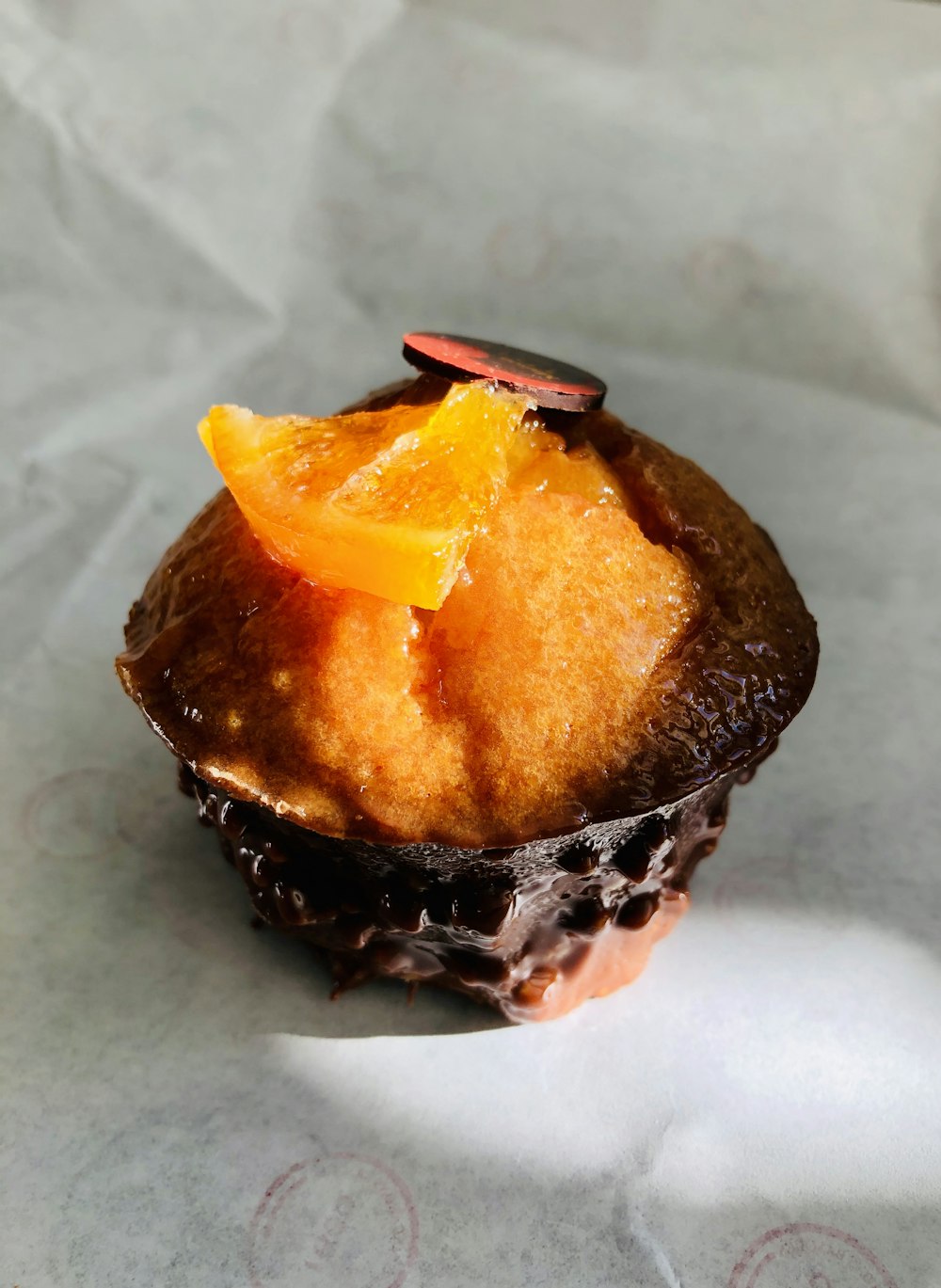 orange and black cake on white textile