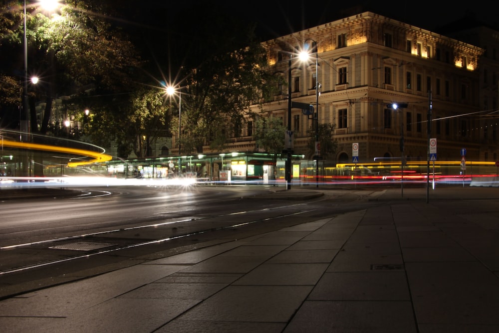 cars on road near building during night time