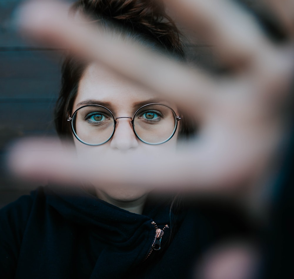 woman in black framed eyeglasses